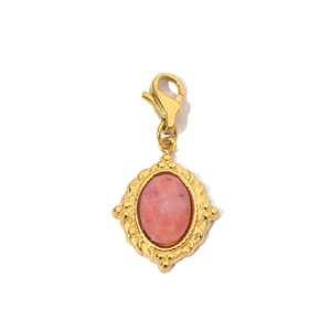 Detail of vintage gold stainless steel sun pendant with pink oval stone and lobster clasp