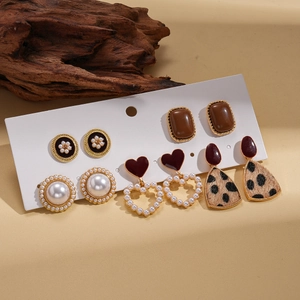 Retro 6-pair earring set featuring pearls, leopard print, and heart shapes on display card