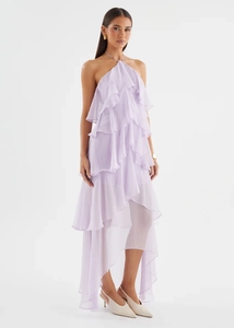 Detail of light purple chiffon dress with halter neck and tiered ruffle hemline