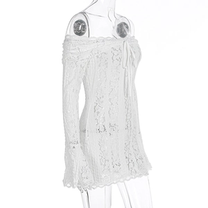 Detailed view of white floral lace fabric and delicate drawstring tie on the bust
