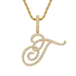 Close-up of hip hop letter J pendant with gold plating and paved zircon stones