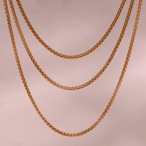 Close-up of triple-layered 18K gold-plated stainless steel box chains for jewelry