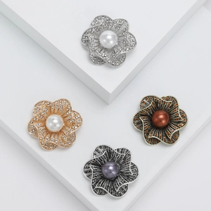 Vintage hollow flower brooch with rhinestones and pearls shown in four elegant finishes