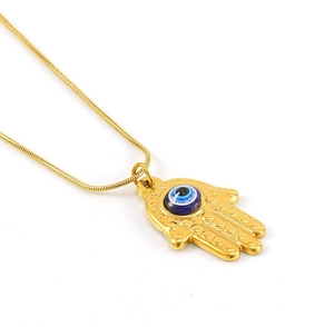 Detailed close-up of gold Hamsa Hand pendant with blue Evil Eye on a snake chain