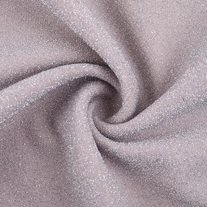 Macro view of sparkly Morandi pink fabric with fine silver glitter for evening dresses
