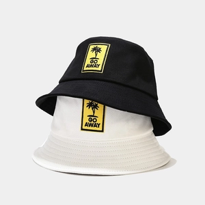 Set of black and white cotton bucket hats with yellow GO AWAY palm tree embroidery