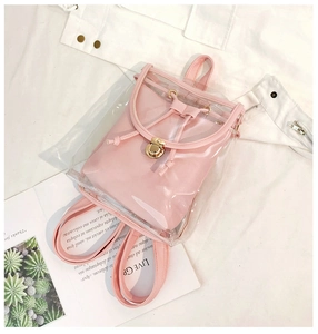 Detailed top view of a pink transparent PVC jelly backpack with a gold metal twist lock