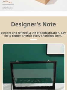 Detail of black badge display case with glass lid and silver metal locks for pins