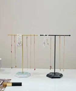 Modern T-bar jewelry stands with marble bases for elegant necklace and earring display