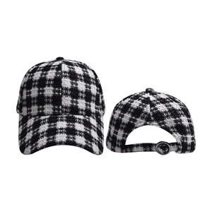 Detail of classic houndstooth baseball cap featuring thick tweed texture and metal buckle