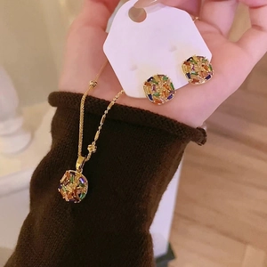 Detail of gold plated colorful zircon square stud earrings and necklace jewelry set