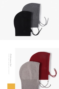 Detail of high-density knitted wool texture and adjustable drawstring on a winter hat
