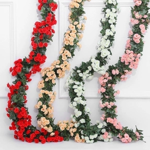 Artificial rose vines in red, champagne, white, and pink for wedding wall decor