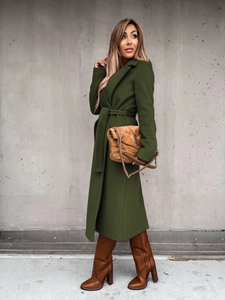 Close-up of olive green long wool coat with lapel collar and matching waist tie