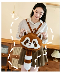 Close-up of a cute raccoon plush backpack with long fur texture worn by a model