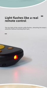 Close-up of toy TV remote for babies showing flashing lights and functional buttons