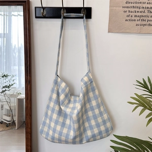 Detail of blue and white checkered canvas tote bag showing thick cotton fabric texture