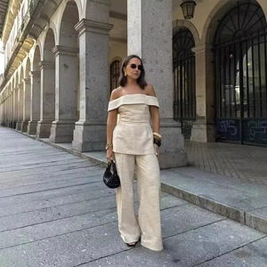 Elegant beige off-shoulder top and high-waist wide-leg pants set for outdoor leisure