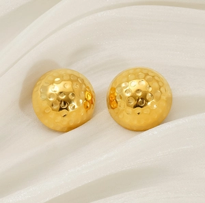 Detailed close-up of 18K gold-plated stainless steel stud earrings with hammered texture