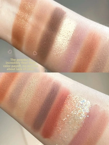 Arm swatches of 26-color eyeshadow palette with matte, shimmer, and glitter finishes