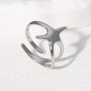 Minimalist silver starfish open ring in stainless steel with a polished metallic finish
