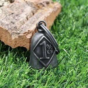 Detail shot of vintage biker guardian bell pendant with 1% ER engraving and antique finish