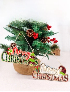 Detail of wooden Merry Christmas hanging signs with red and green buffalo plaid patterns