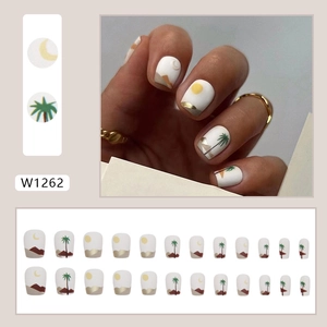 Short matte press-on nails set with desert sun and palm tree art for sweet chic style