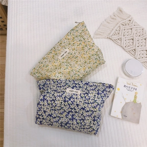 Floral cotton cosmetic pouch set in blue and yellow with 'simple wish' woven label