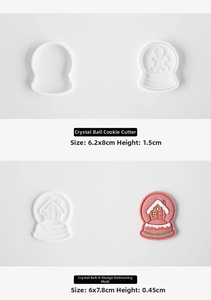 Detail of 3D snow globe cookie mold featuring gingerbread man and winter cabin designs