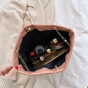 Pink quilted chain bucket bag showing large capacity for cosmetics and phone