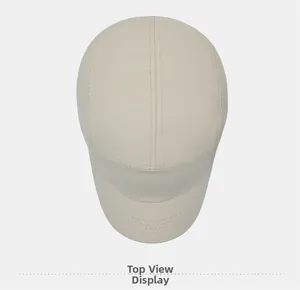Top view detail of the stitching and seams on a beige 5-panel canvas baseball cap