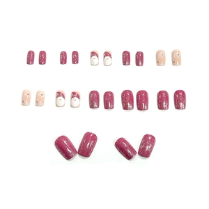 Christmas press-on nails set featuring Santa Claus and snowflakes in pink and nude colors