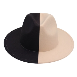 Macro shot of two-tone black and white felt fedora hat showing fine wool texture and stitching