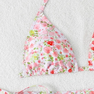 Close-up of floral print bikini top with pink flowers and delicate ruffle details