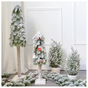 Macro detail of 45cm flocked mini Christmas tree with red ornaments and cedar wood base