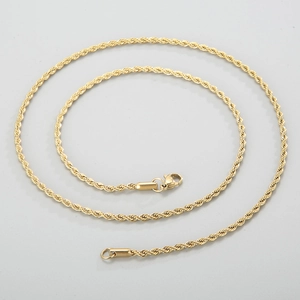 Detail view of a twisted rope chain necklace in gold finish with lobster clasp closure