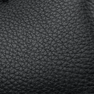 Macro shot showcasing the detailed texture of high-quality black pebble grain leather