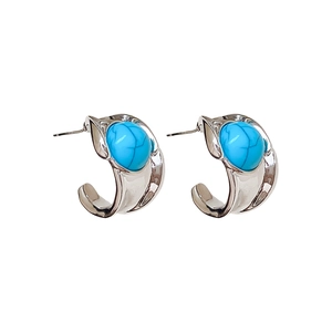 Vintage C-shaped silver earrings with oval turquoise inlay and polished finish