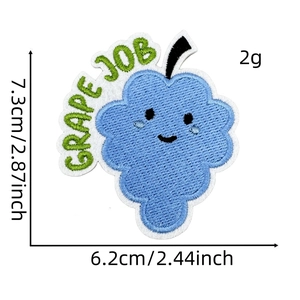 Detail view of grape embroidery patch with measurements and Grape Job slogan on white background