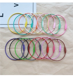 Detailed view of colorful coated steel wire keychains with secure spiral metal fasteners