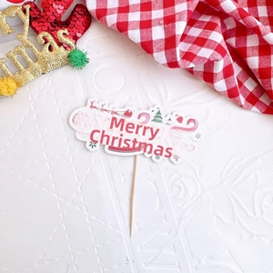Red and white Merry Christmas cake topper decoration for festive holiday baking needs