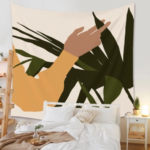 Detail of minimalist tapestry featuring abstract hand and palm leaf design in a bedroom