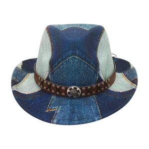 Detail of western fedora with denim texture, brown leather band and vintage metal emblem