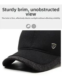 Close-up of the sturdy brim and shield-shaped metal logo on the winter baseball cap