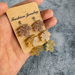 Fashionable autumn maple leaf acrylic earrings featuring glittering resin and fall colors