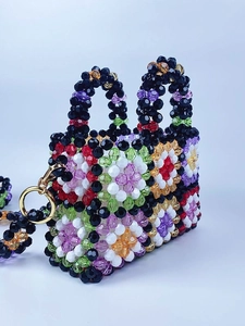 Handmade checkered beaded handbag with colorful flower patterns and metal ring handles
