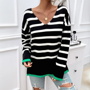 Women's V-neck black and white striped knit sweater with green trim detail for casual wear