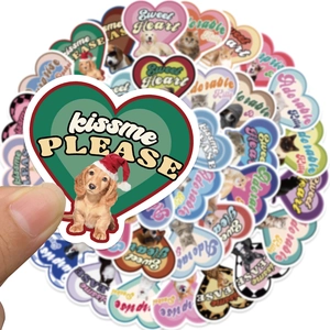 Close-up of heart-shaped pet stickers featuring cute cats and dogs on waterproof vinyl