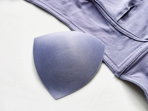 Detail of purple ribbed cotton fabric and removable triangular sponge padding insert